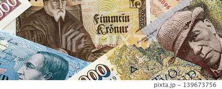 Icelandic krona money bills pile on table. Iceland banknotes of ISK currency close up Icelandic krona money bills pile on table. Iceland banknotes of ISK currency close up 139673756