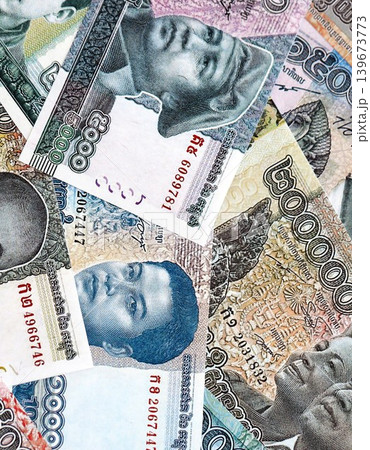 Cambodian riel money bills pile on table. Cambodia banknotes of KHR currency close up 139673773