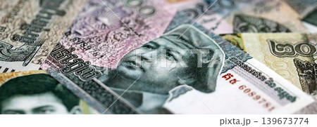 Cambodian riel money bills pile on table. Cambodia banknotes of KHR currency close up 139673774