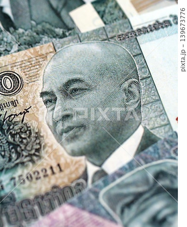 Cambodian riel money bills pile on table. Cambodia banknotes of KHR currency close up 139673776