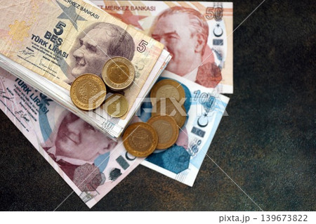 Turkish lira money bills and kurus coins pile on table. Turkey coins on banknotes of TRY currency 139673822