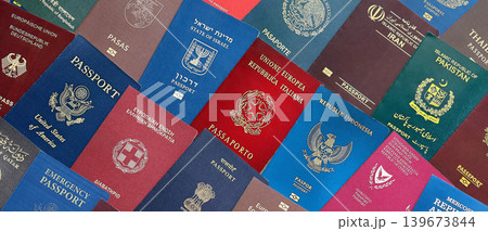 Big amount of passports of various different countries. Covers of expired passports close up 139673844