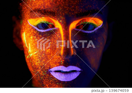 Portrait, art and beauty with neon woman on black background for makeup, glitter or colorful glow. Face, fantasy and creative with confident young person in the dark for psychedelic or techno paint 139674059