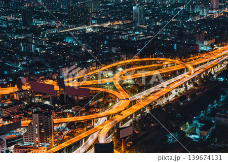 Bangkok city with skyscraper building and illuminated expressway and billboards in business district Bangkok city with skyscraper building and illuminated expressway and billboards in business district 139674131
