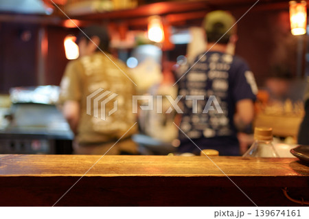 Wooden tabletop of traditional Izakaya restaurant blurred scene Wooden tabletop of traditional Izakaya restaurant blurred scene 139674161