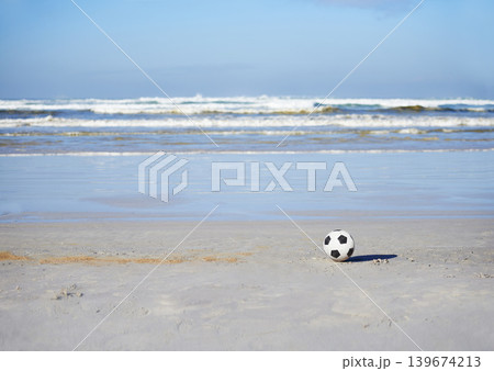 Soccer ball, sport and games for holiday at beach, outdoor fun and recreation in summer on vacation. Celebrate, playing or leisure on travel by sea, freedom or football competition in brazil by ocean Soccer ball, sport and games for holiday at beach, outdoor fun and recreation in summer on vacation. Celebrate, playing or leisure on travel by sea, freedom or football competition in brazil by ocean 139674213