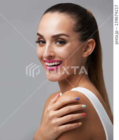 Happy woman, manicure for beauty and makeup, face of model for cosmetics and nail polish isolated on grey background. Smile in portrait, rainbow color nails and glamour, confident and skin in studio Happy woman, manicure for beauty and makeup, face of model for cosmetics and nail polish isolated on grey background. Smile in portrait, rainbow color nails and glamour, confident and skin in studio 139674217