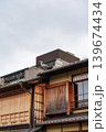 Heron bird perched on roof of traditional house in Kyoto, Japan Heron bird perched on roof of traditional house in Kyoto, Japan 139674434