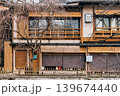 Traditional wooden machiya house facade with bare tree in Kyoto Traditional wooden machiya house facade with bare tree in Kyoto 139674440