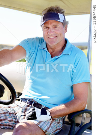 Man, portrait and smile in golf cart on grass as professional athlete for transportation, hobby or sport. Mature person, face and pro driving on course at club or talent training, vacation or holiday 139674449