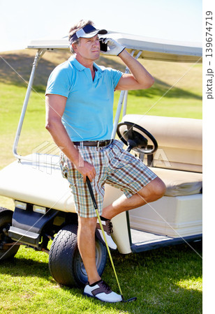 Man, phone call and golf cart on course for communication at sports training for professional player, talent or skill. Mature person, digital device and club on grass for weekend chat, hobby or pro Man, phone call and golf cart on course for communication at sports training for professional player, talent or skill. Mature person, digital device and club on grass for weekend chat, hobby or pro 139674719