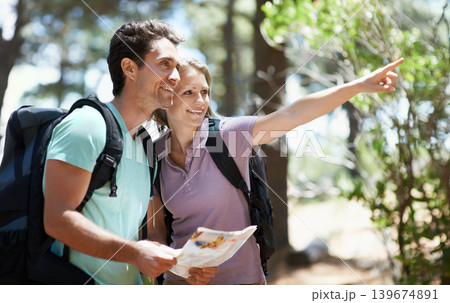 Couple, hiking in nature and map for direction, documents guide or location information of forest travel or journey. Man and woman trekking with infographics, search woods and pointing to destination Couple, hiking in nature and map for direction, documents guide or location information of forest travel or journey. Man and woman trekking with infographics, search woods and pointing to destination 139674891