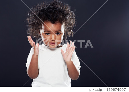 Cute, kid and girl with expression, thinking and contemplation on a dark studio background. Mockup space, adorable toddler and child development with hands up and emoji with thoughts and wonder 139674907