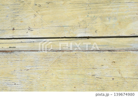 Weathered light yellow wooden planks texture Weathered light yellow wooden planks texture 139674980