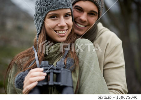 Portrait, binocular and happy couple hiking on nature journey, travel adventure or forest jungle. Marriage, love and face of people smile for outdoor trekking, bird watching or camping trip in woods 139675040