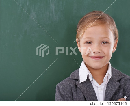 Child, portrait and chalkboard for school learning in classroom for education, writing or homework. Female person, uniform and kindergarten development or brainstorming or knowledge, growth or mockup 139675146