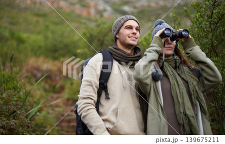Couple, travel in nature and binoculars for hiking, adventure and journey or explore together in eco friendly mountains. Happy man and woman trekking with outdoor search, vision or birdwatching lens Couple, travel in nature and binoculars for hiking, adventure and journey or explore together in eco friendly mountains. Happy man and woman trekking with outdoor search, vision or birdwatching lens 139675211