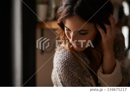 Lonely, depression and young woman at a home with upset, grief and mad facial expression for problem. Mental health, emotion and sad female person looking down with unhappy face for loss at house. Lonely, depression and young woman at a home with upset, grief and mad facial expression for problem. Mental health, emotion and sad female person looking down with unhappy face for loss at house. 139675217
