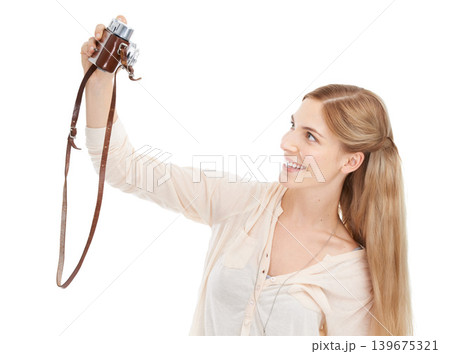 Camera, happy woman and selfie in studio for fun hobby, memory or photoshoot on white background. Lens, face or female model smile for self portrait with vintage, retro or photography equipment 139675321