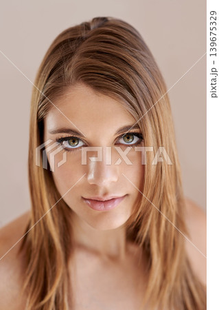 Beauty, makeup and portrait of young woman in studio with natural, glow and facial routine. Confidence, cosmetics and female person with self care, dermatology and face treatment by brown background. 139675329
