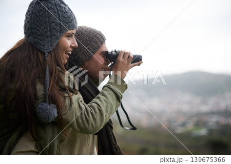 Couple, travel and binoculars on mountains for journey, adventure and hiking or explore together with cityscape. Man and woman trekking with outdoor search, vision or birdwatching lens in tourism Couple, travel and binoculars on mountains for journey, adventure and hiking or explore together with cityscape. Man and woman trekking with outdoor search, vision or birdwatching lens in tourism 139675366
