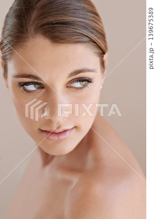 Face, beauty and skincare of woman in makeup at studio isolated on a brown background. Thinking, serious or young model in cosmetics, healthy glow of aesthetic or spa facial treatment for dermatology Face, beauty and skincare of woman in makeup at studio isolated on a brown background. Thinking, serious or young model in cosmetics, healthy glow of aesthetic or spa facial treatment for dermatology 139675389