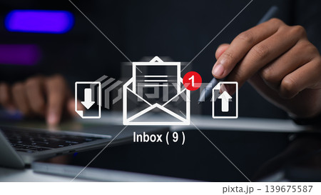 Professional using laptop with email inbox icon and notification. Concept of digital marketing, online communication, message receiving, and data file transfer in business technology background. 139675587