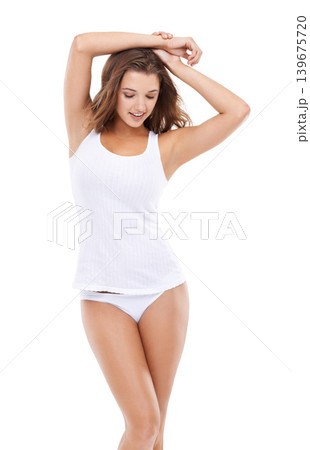 Confidence, underwear or happy woman in tank top with smile, beauty or healthy body in studio. Natural, fashion model or female person in lingerie with pride or wellness isolated on white background Confidence, underwear or happy woman in tank top with smile, beauty or healthy body in studio. Natural, fashion model or female person in lingerie with pride or wellness isolated on white background 139675720