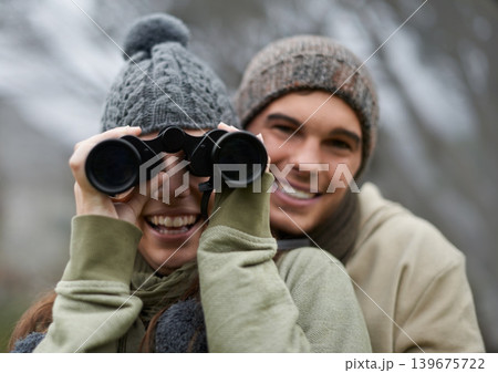 Binoculars, nature and happy couple in portrait for journey, adventure in hiking or carbon footprint travel. Face of young man and woman with outdoor gear for birdwatching in winter, nature or woods 139675722