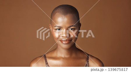 Face, beauty and smile with happy black woman in studio isolated on brown background for wellness. Portrait, skincare and aesthetic for foundation cosmetics or dermatology with a natural bald person Face, beauty and smile with happy black woman in studio isolated on brown background for wellness. Portrait, skincare and aesthetic for foundation cosmetics or dermatology with a natural bald person 139675817