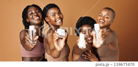 Happy black woman, skincare and beauty products for tone or foundation against a brown studio background. Group portrait of African female people or model smile together with skin makeup on mockup 139675870