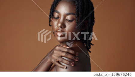 Face, beauty and skincare with happy black woman in studio isolated on brown background for wellness. Portrait, aesthetic and smile for foundation cosmetics or dermatology with a natural young person Face, beauty and skincare with happy black woman in studio isolated on brown background for wellness. Portrait, aesthetic and smile for foundation cosmetics or dermatology with a natural young person 139676246