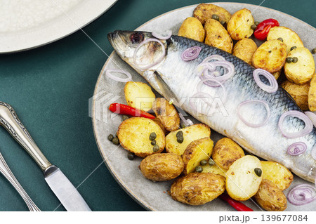 Salted herring with potatoes, onion and herbs 139677084