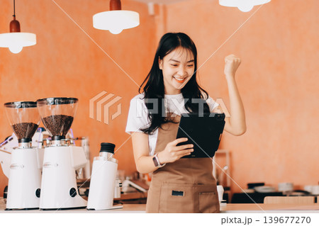Young woman at barista school learning how to make espresso coffee. Young woman at barista school learning how to make espresso coffee. 139677270