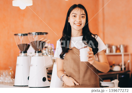Young woman at barista school learning how to make espresso coffee. Young woman at barista school learning how to make espresso coffee. 139677272