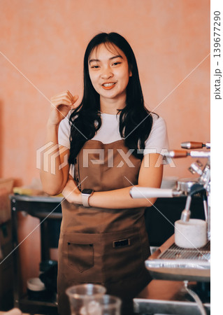 Young woman at barista school learning how to make espresso coffee. 139677290