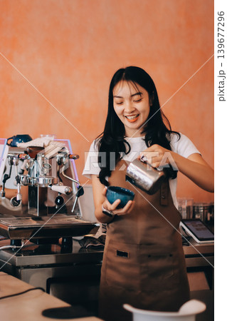 Young woman at barista school learning how to make espresso coffee. 139677296