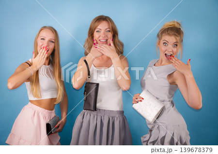Shocked women holding hand purse wallet 139678379