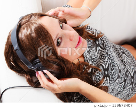 woman in headphones listening music mp3 relaxing woman in headphones listening music mp3 relaxing 139678407