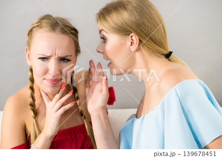 Two teen women gossiping 139678451