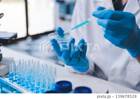 Lab technician experimenting in lab Lab technician experimenting in lab 139678529