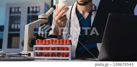 Attractive student of chemistry working in laboratory Attractive student of chemistry working in laboratory 139678543
