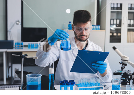 Lab technician experimenting in lab 139678809