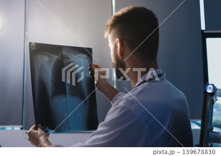 Man, doctor and laptop typing in healthcare research, communication or social media at office desk. Male medical expert working on computer in online search, browsing or chatting on tablet at clinic Man, doctor and laptop typing in healthcare research, communication or social media at office desk. Male medical expert working on computer in online search, browsing or chatting on tablet at clinic 139678830