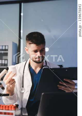 Attractive student of chemistry working in laboratory Attractive student of chemistry working in laboratory 139678841
