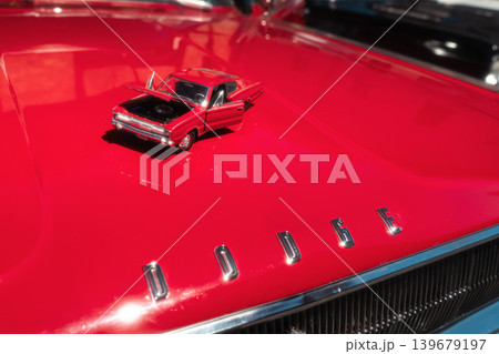 Berlin, Germany - May 2, 2026: Dodge hood with miniature car 139679197