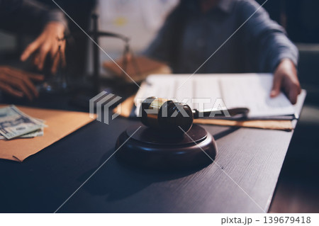 Lawyer explained to the client about the law that must be brought against the court case. 139679418