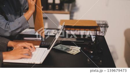 Lawyer explained to the client about the law that must be brought against the court case. 139679473