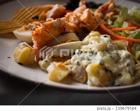 Salmon and potato salad on a plate 139679584