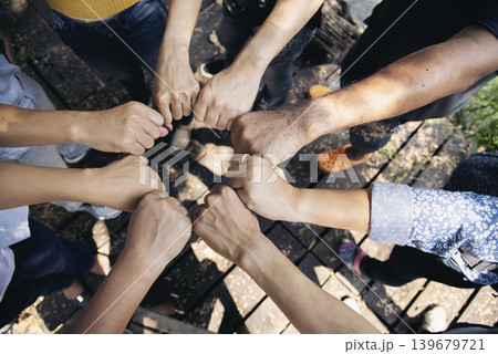 Diverse multiethnic Partners hands together teamwork group of multiracial people meeting join hands togetherness. Diversity people hands join empower partnership teams connection volunteer community Diverse multiethnic Partners hands together teamwork group of multiracial people meeting join hands togetherness. Diversity people hands join empower partnership teams connection volunteer community 139679721